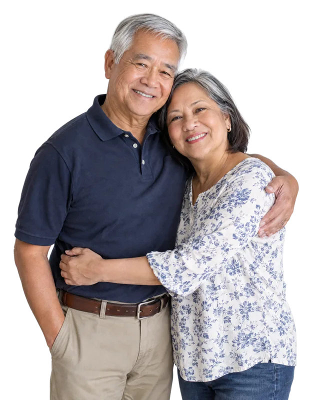 A relaxed, happy retired couple embracing at home